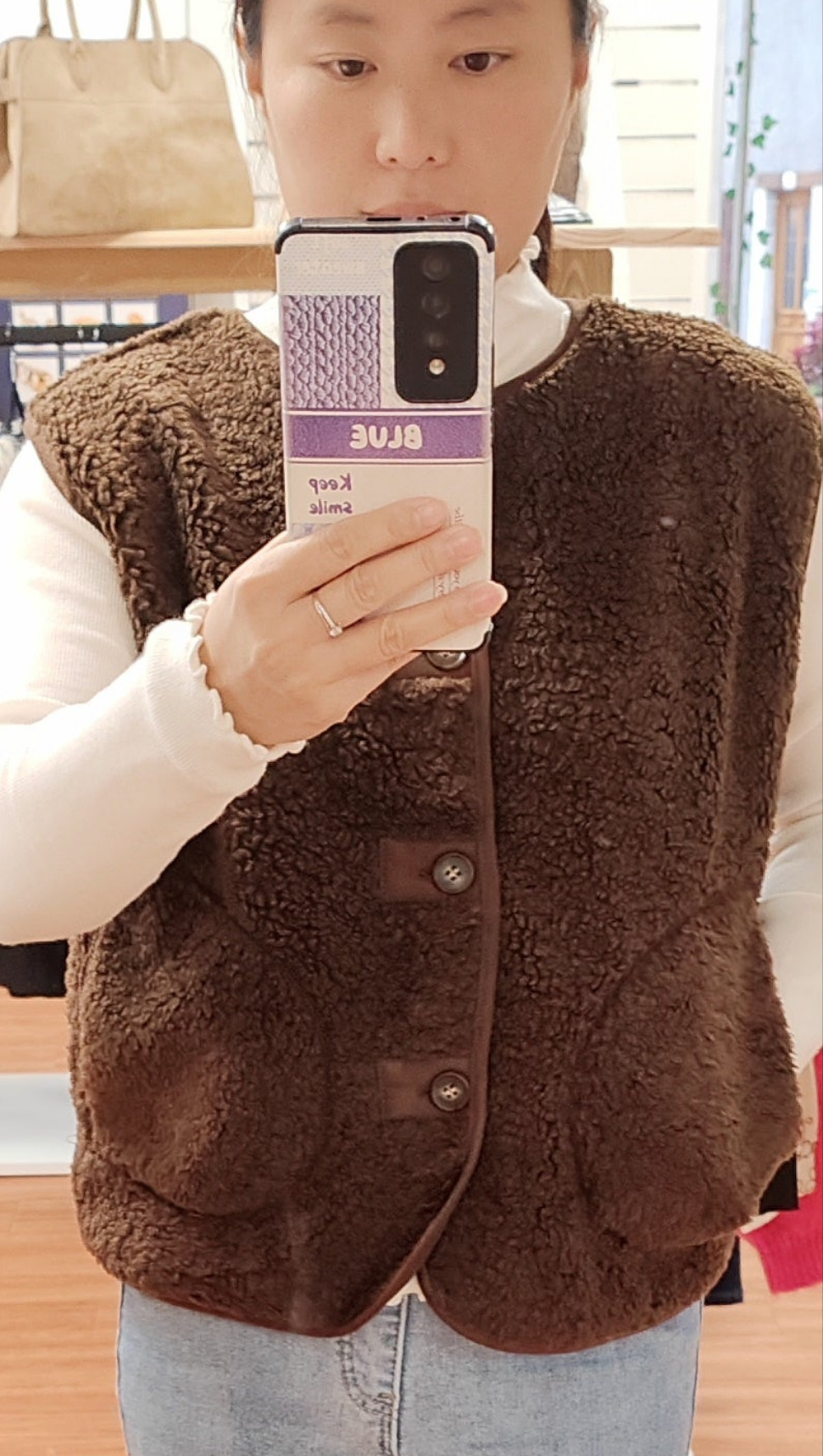 Gilet sans manches effet mouton à boutons